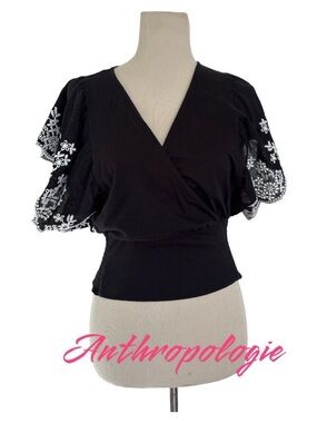 Anthropologie Black Wrap-Style Top with White Embroidered Flutter Sleeves